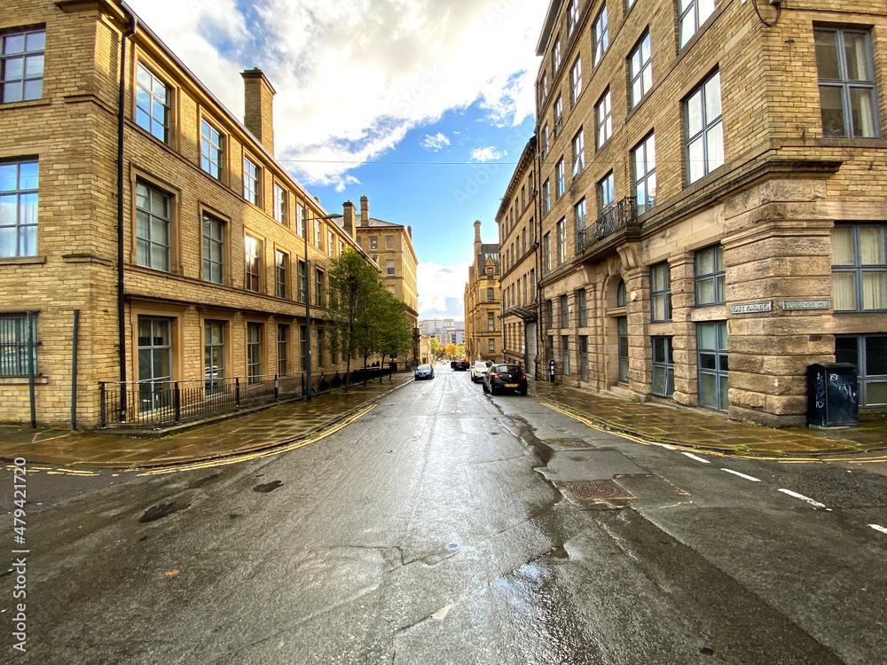 View down East Parade with Victorian warehouses, on a wet day, in the post industrial city of, Bradford, UK