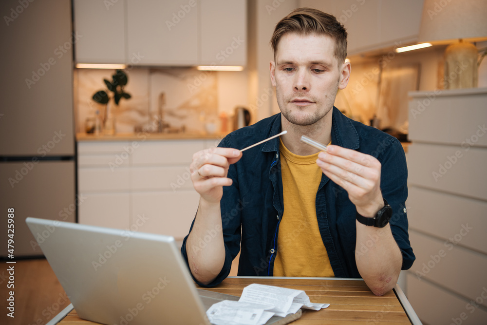 Home test for COVID19 Man usinf test swab kit. Coronavirus nasal swab test for infection