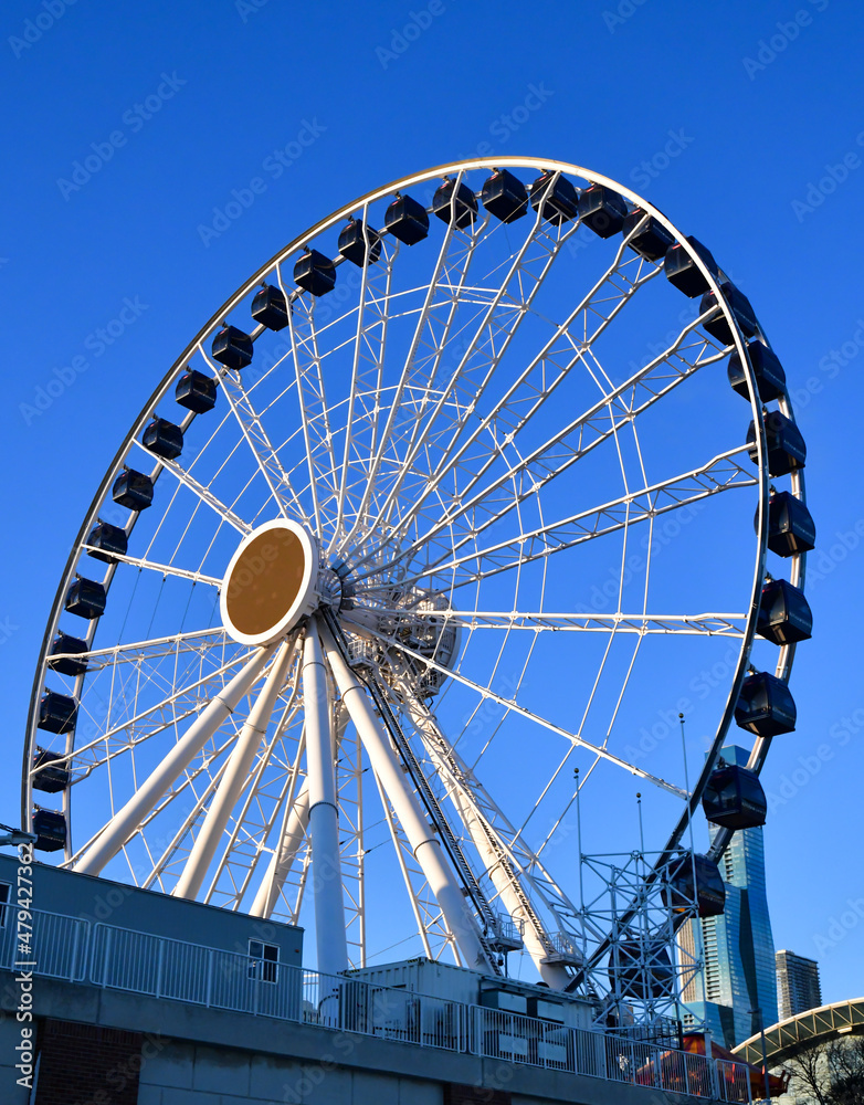 Big City Amusement Park  Ferris Wheel against Blue Sky