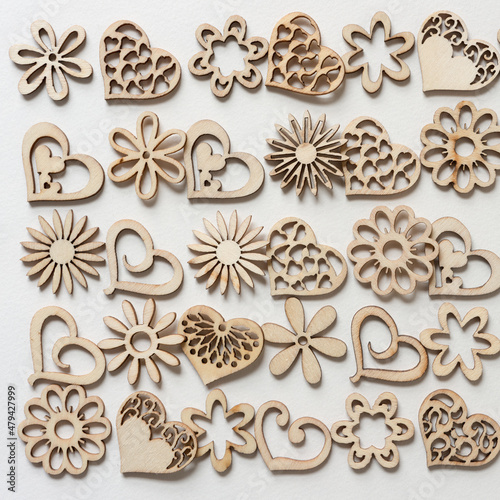 set of fancy wooden hearts and florals on paper