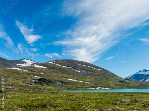 mountains and clouds along the kings trail in northern sweden photo