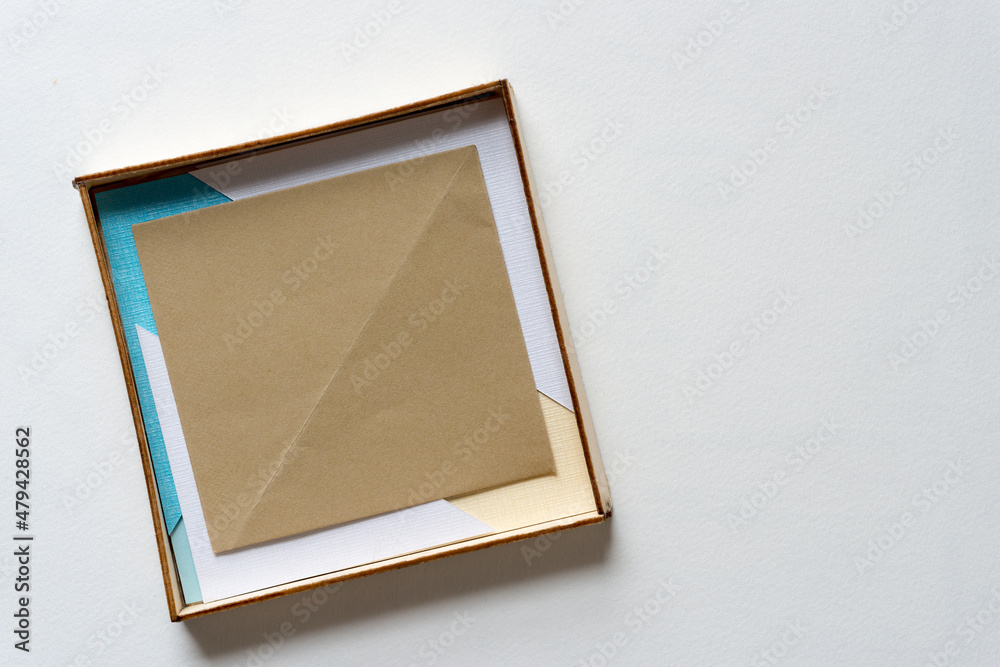 Fototapeta premium box with paper on a light background
