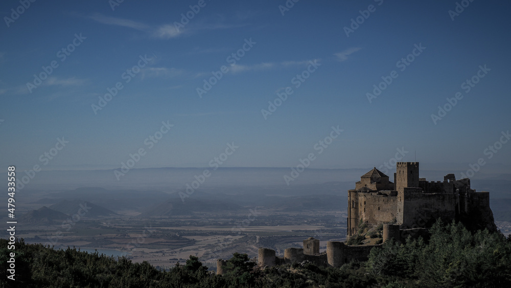 The Castle of Loarre is a Romanesque Castle and Abbey located near the town of the same name in Aragon, Spain. There are great views of the Pyrenees all around it.