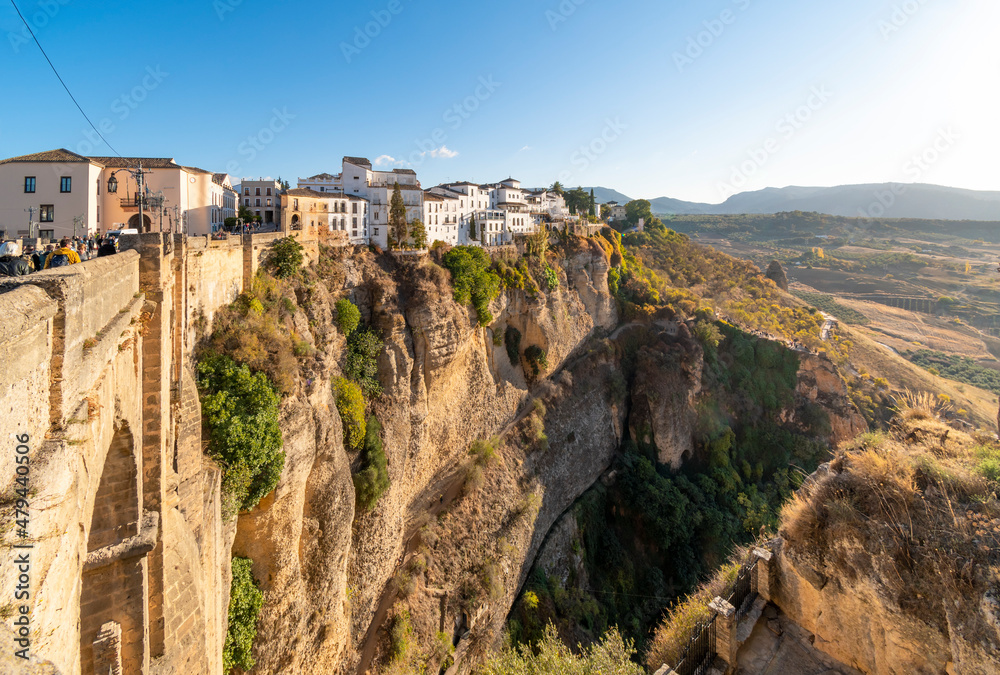 View of the medieval hillside town from one of the cono balconies overlooking the gorge, bridge and canyon valley in Ronda, Spain
