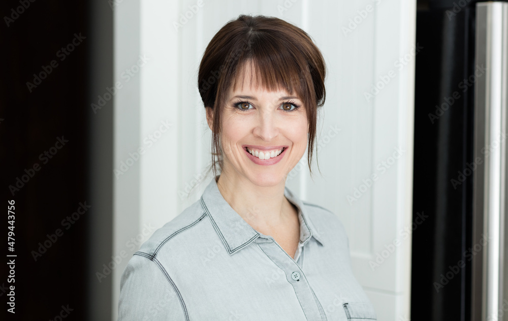 Portrait Of A Pretty Woman Smiling At The Camera Isolated On White	