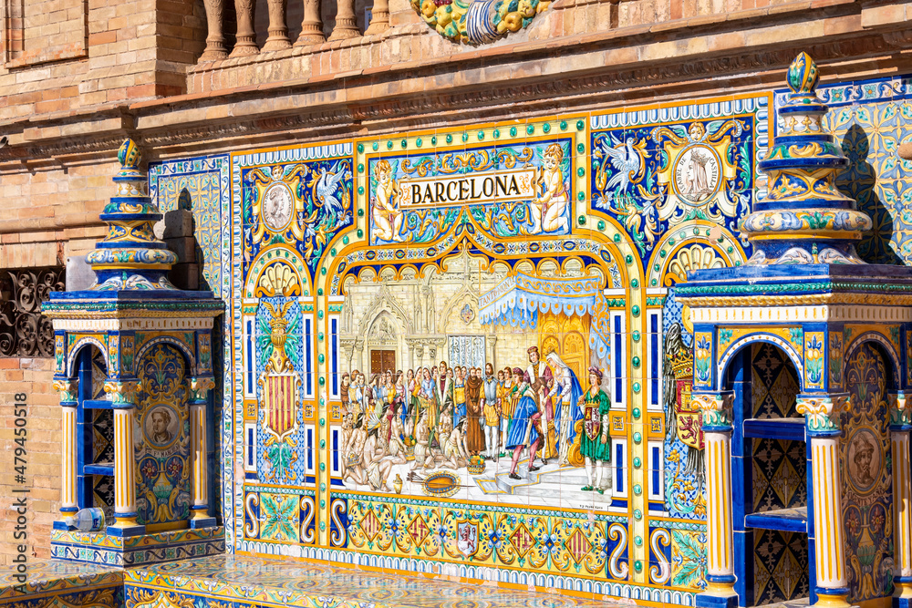Colorful Andalucian Spanish tiles depicting the city of Barcelona inside the Plaza de Espana in Seville, Spain.