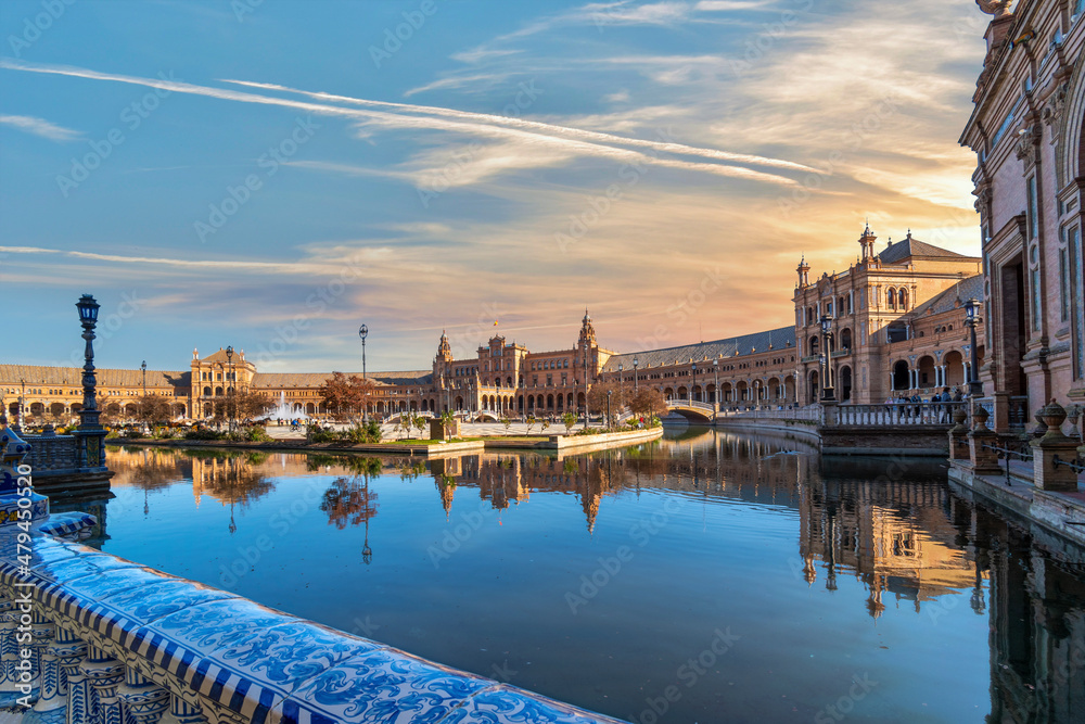 Sunset view of the Plaza de Espana or Spanish Square, a public park and gathering place in Seville, Spain.