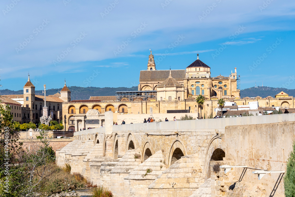The Great Mosque of Córdoba or Mezquita seen from the Roman Bridge along the Guadalquivir River in Cordoba, Spain.