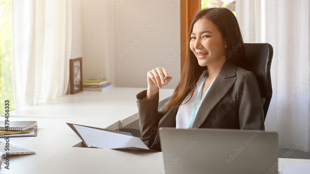 Female executive manager sitting in the modern office. Female executive manager sitting in the modern office.