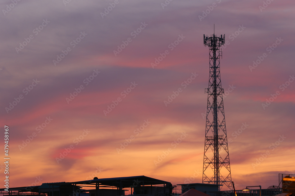 Telephone tower on evening cloud and twilight sky background.