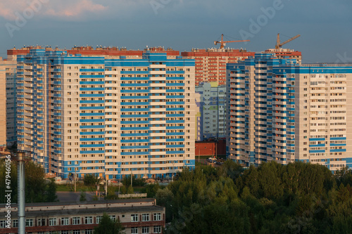 provincial city of Russia with high-rise buildings in the evening