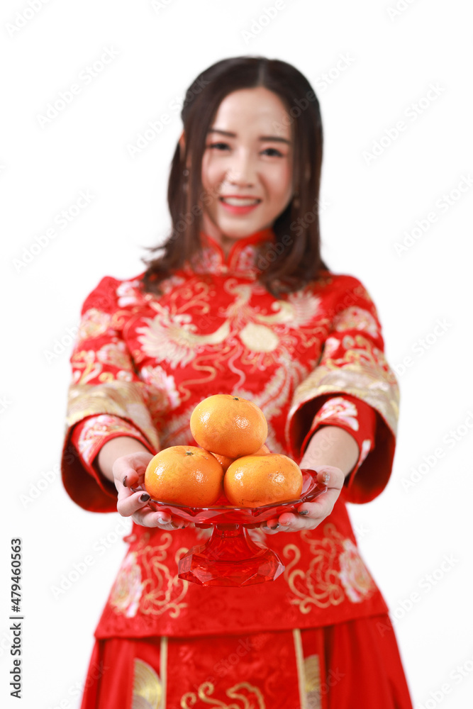 Selective focus portrait Asia woman give orange to respect and greeting to someone ,Chinese New Year festival Selective focus portrait Asia woman give orange to respect and greeting to someone ,Chinese New Year festival