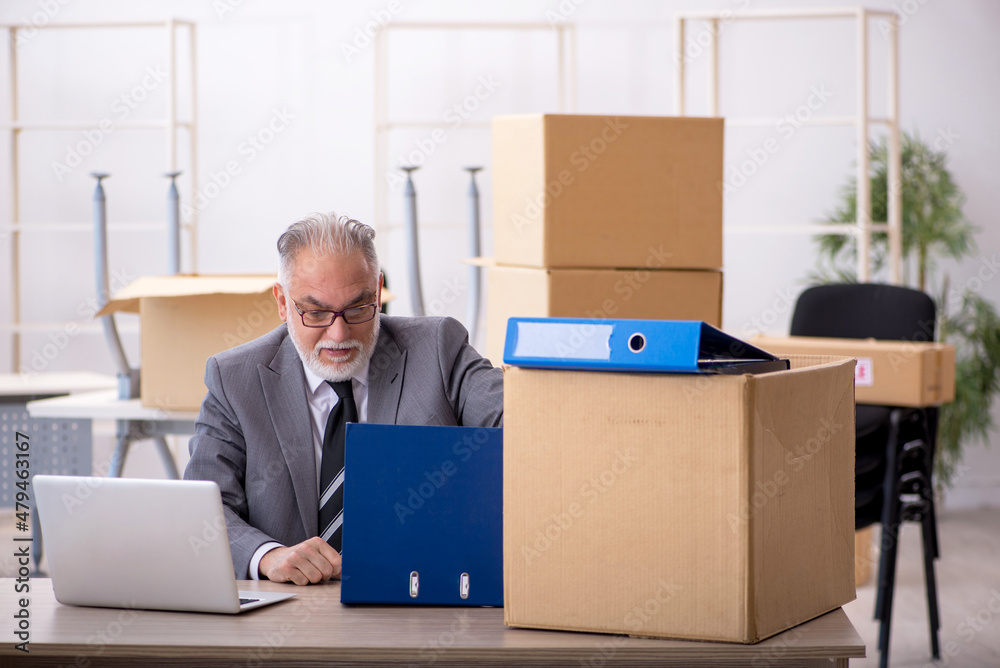 Old male employee in relocation concept Old male employee in relocation concept
