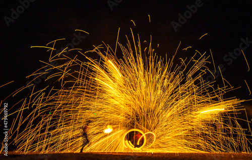 Fire show on the beach at night in Phuket, Thailand