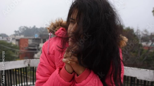 woman in a jacket in winters in India