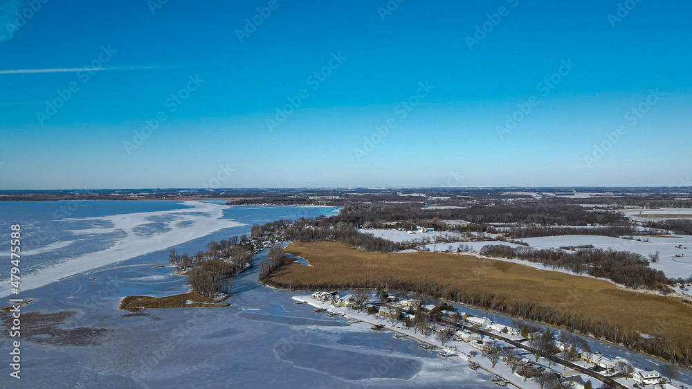 Frozen lake with bright sky