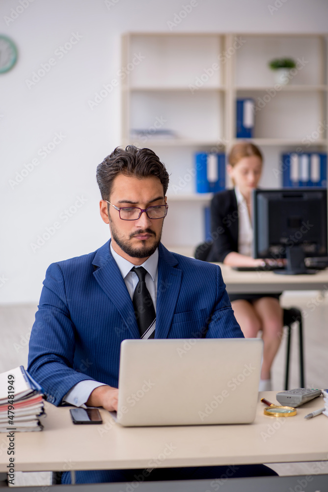 Two colleagues working in the office Two colleagues working in the office