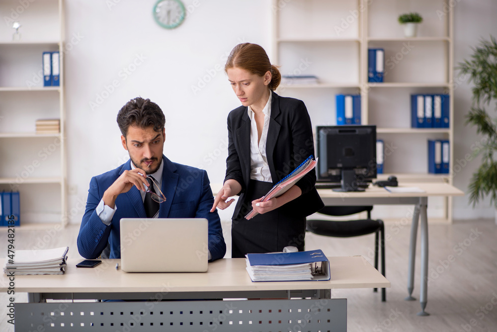 Two colleagues working in the office Two colleagues working in the office