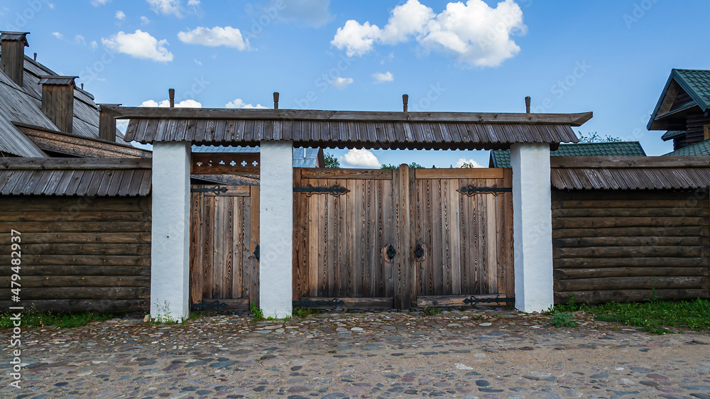 old gate with white stone pillars old gate with white stone pillars