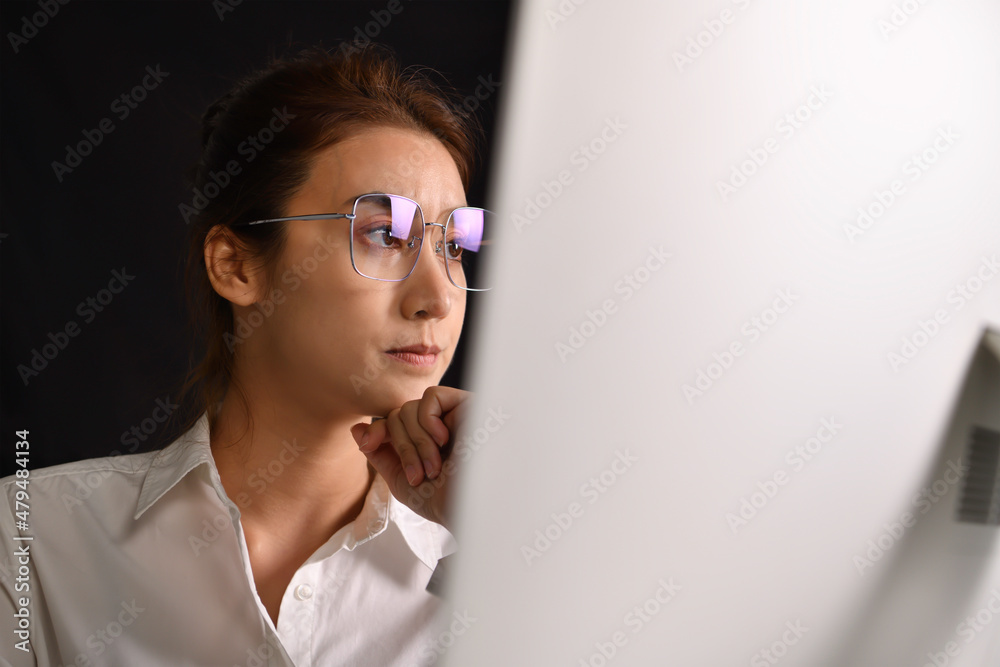 Feeling tired and stressed. Young Asian woman sitting looking deep in thought exhausted and tired during working using computer. Overworked tired Asian female worker looking exhausted and fatigue Feeling tired and stressed. Young Asian woman sitting looking deep in thought exhausted and tired during working using computer. Overworked tired Asian female worker looking exhausted and fatigue