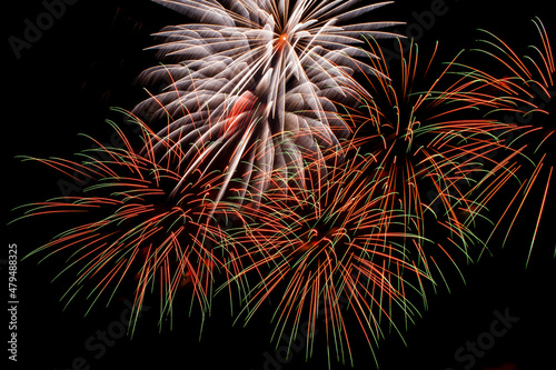 Colorful fireworks on a night sky background.