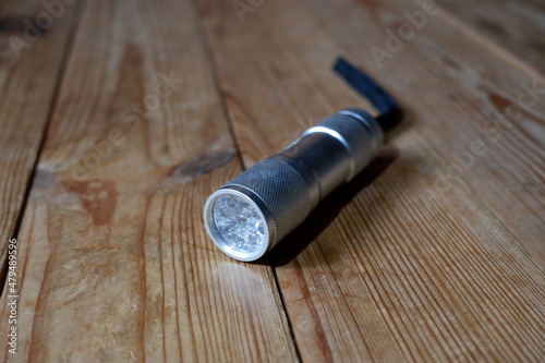 LED flashlight lying on the floor