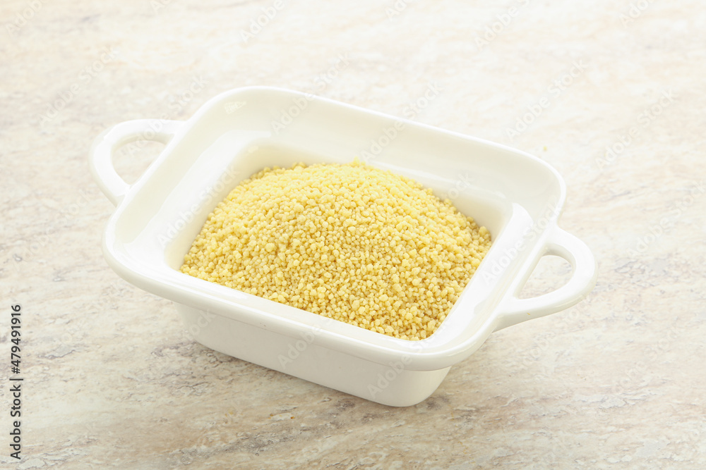 Raw couscous in the bowl Raw couscous in the bowl