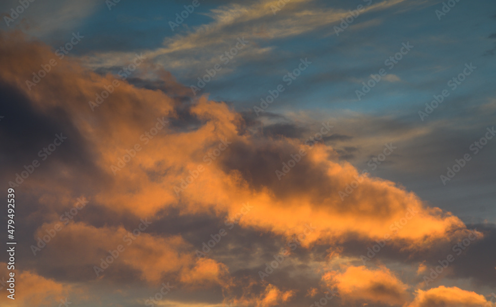 Sunset sky. Detail view of some spectacular clouds in red and orange color. Sunset sky. Detail view of some spectacular clouds in red and orange color.