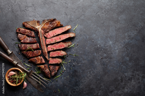 Fotografie Grilled porterhouse beef steak. Sliced T-bone