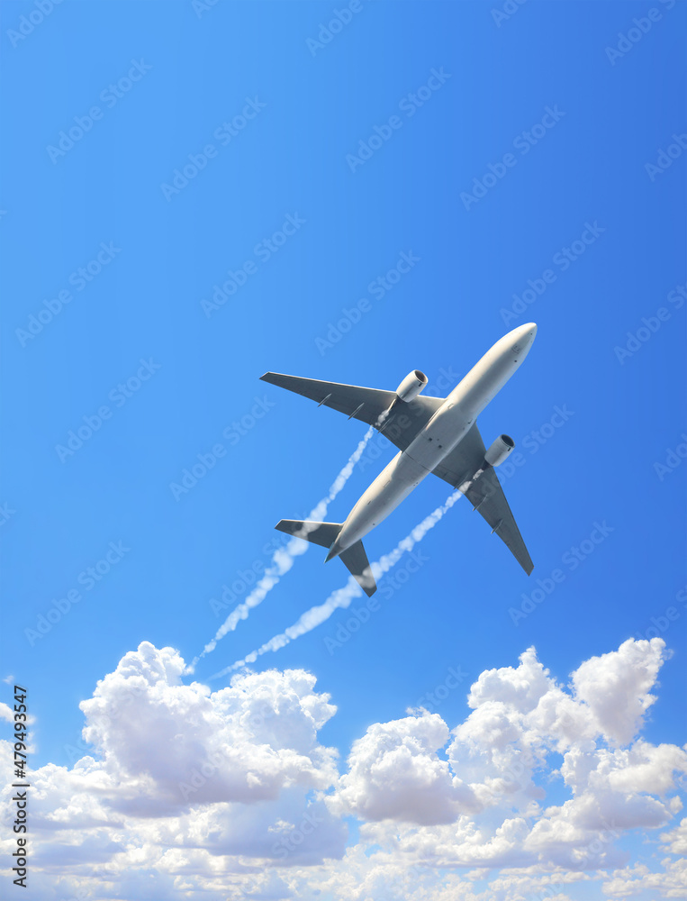 Vertical nature background with aircraft and Jet trailing smoke in the sky. Airplane and condensation trail Vertical nature background with aircraft and Jet trailing smoke in the sky. Airplane and condensation trail