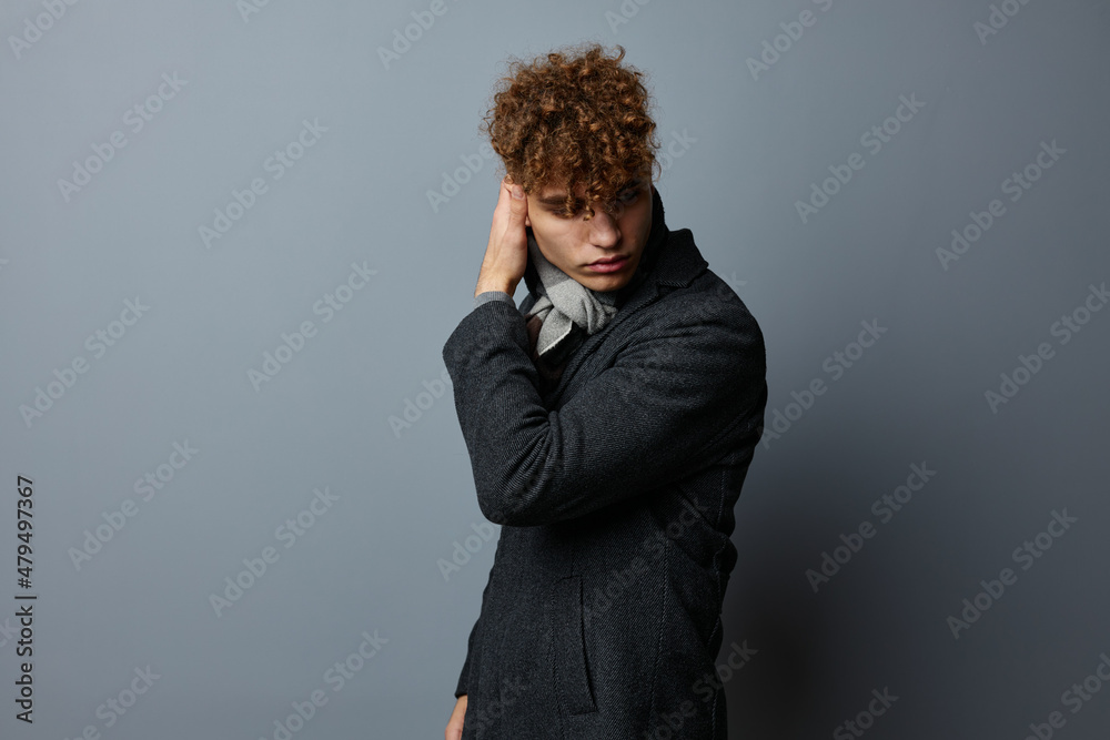 handsome guy in a coat a checkered scarf isolated background handsome guy in a coat a checkered scarf isolated background