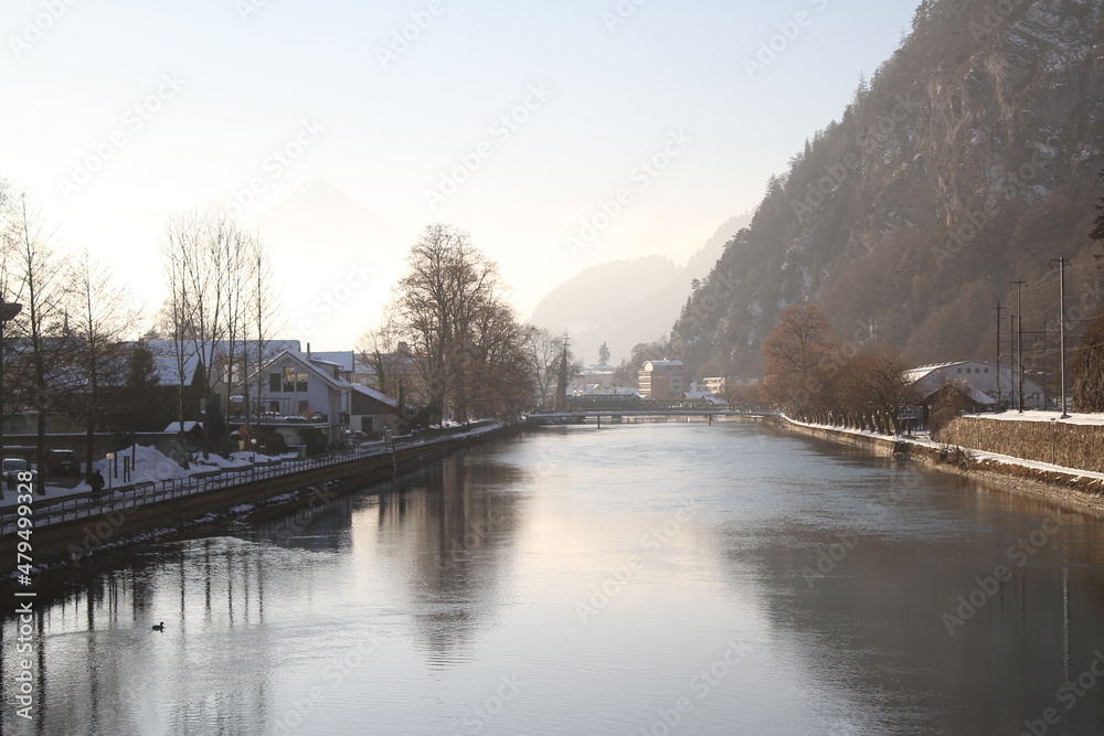 Aare river at dusk, Interlaken, Switzerland, in Winter with snow. Aare river at dusk, Interlaken, Switzerland, in Winter with snow.