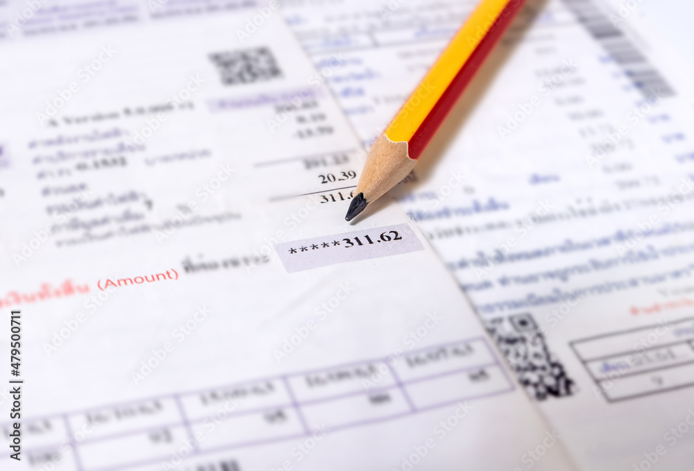 Utility energy bill with pencil blurred background Utility energy bill with pencil blurred background