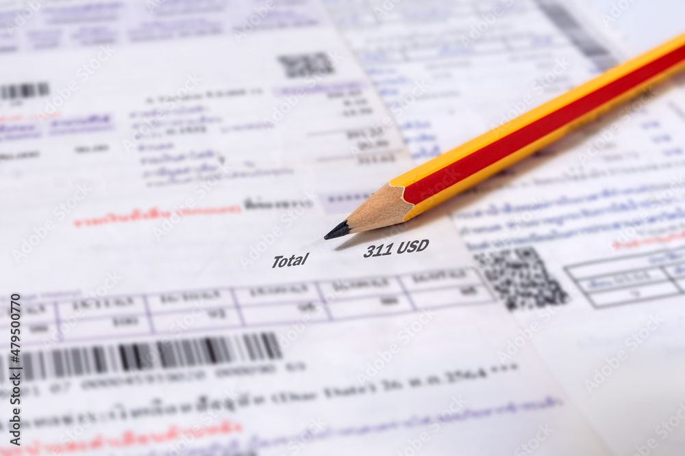Utility energy bill with pencil blurred background Utility energy bill with pencil blurred background