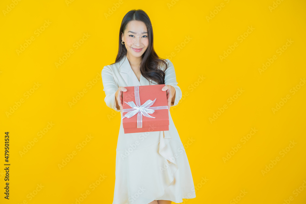 Portrait beautiful young asian woman smile with red gift box Portrait beautiful young asian woman smile with red gift box