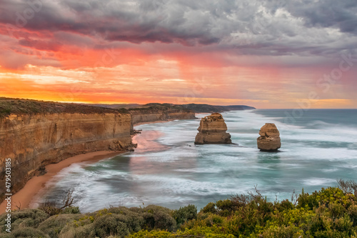 Australia, Victoria, Long exposure of Twelve Apostles and Gibson Steps in Port Campbell National Park at cloudy dawn photo