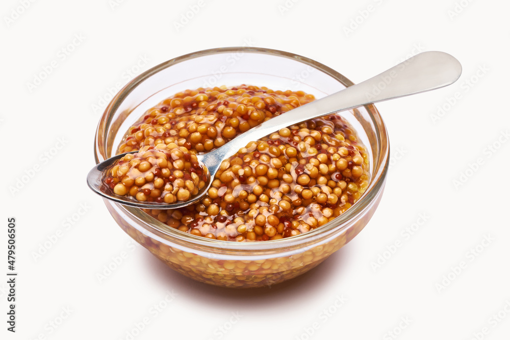 Classic Dijon mustard sauce in glass bowl isolated on white background Classic Dijon mustard sauce in glass bowl isolated on white background