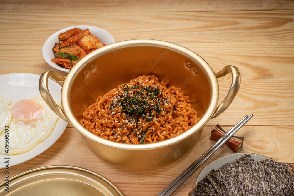 Super Spicy Korean noodles, Ramyun or hot ramen Korean dry noodles food, Korean style instant ramen spicy served with fried egg.