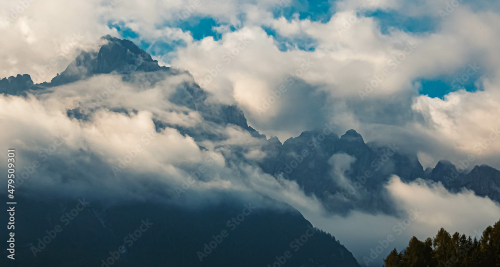 Beautiful alpine summer view of the famous Gailtaler Alps shrouded in clouds near Lienz, Eastern Tyrol, Austria Beautiful alpine summer view of the famous Gailtaler Alps shrouded in clouds near Lienz, Eastern Tyrol, Austria