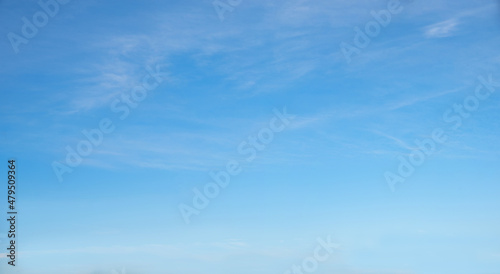 bright blue sky with light haze clouds photo