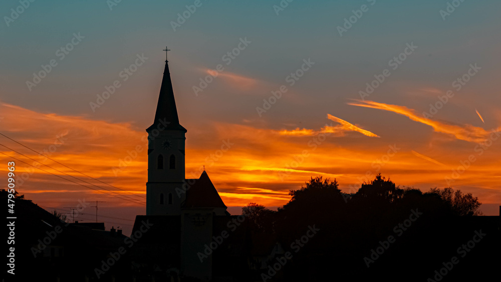 Beautiful sunset with a church silhouette near Gergweis, Bavaria, Germany