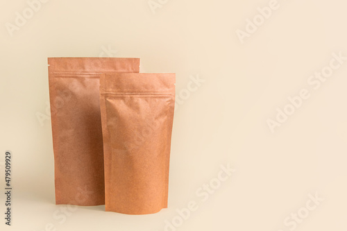 Pouch bag mockup neutral beige background monochrome. Merchandise packaging Blank brown kraft paper pack coffee beans product template copy space. Tea food snack delivery Shop store sale demonstration