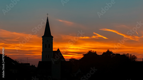 Beautiful sunset with a church silhouette near Gergweis, Bavaria, Germany © Martin Erdniss