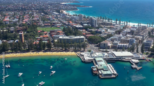Aerial drone view of Manly suburb on the Northern Beaches of Sydney, Australia showing the Manly Ferry Wharf during summer on a sunny day