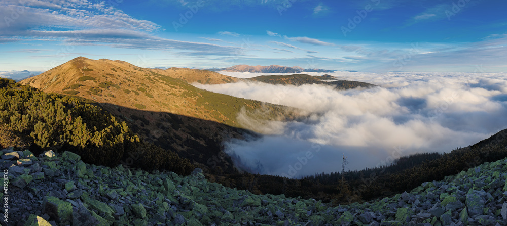 Fototapeta premium Mountainous landscape with hills and valleys at a sunny day in autumn season. The Low Tatras National Park in Slovakia, Europe.