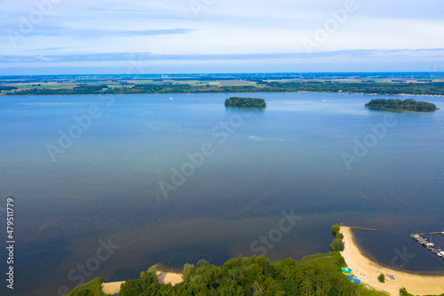 Aerial view of the Wolderwijk lake with small green islands that offer shelter to various species of fish and birds. Dutch province of Flevoland, Netherlands. photo