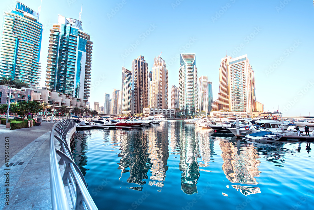 Dubai, United Arab Emirates – February 13, 2021: Scenic view of a yachts at Dubai Marina in the largest city in the United Arab Emirates against the backdrop of skyscrapers.