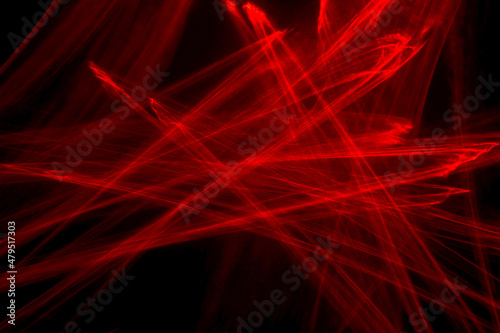 Abstract red lines drawn by light on a black background