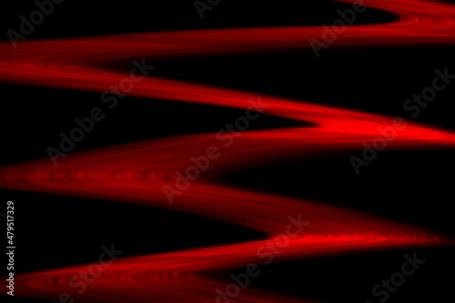 Abstract red lines drawn by light on a black background
