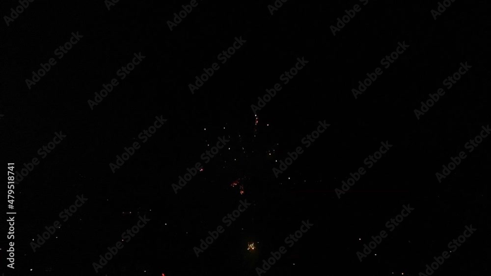 Exploding Red Orange Fireworks Against Black Night Sky. Slow Motion, Locked Off Exploding Red Orange Fireworks Against Black Night Sky. Slow Motion, Locked Off